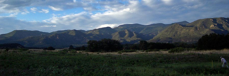 A panoramic photograph of late afternoon light across the Wet Mountains in Colorado.